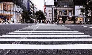 group of people getting ready to cross the street