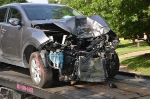 front car collision on top of a tow truck