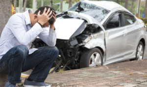 car crash and a man with headache, car accident