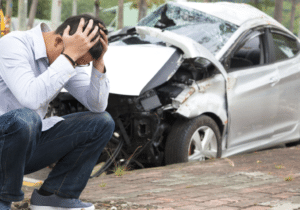 car crash and a man with headache, car accident